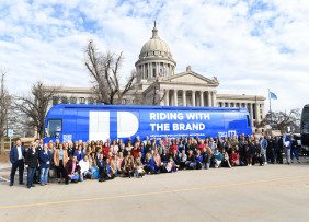 Members in front of bus for Oklahoma Riding with the Brand tour on 2/14/2023