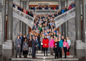Riding With The Brand, Lexington, Kentucky - Kentucky REALTORS® pose on house chamber stairs.