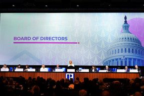 NAR President Leslie Rouda Smith at the podium of the 2022 REALTORS® Legislative Meetings Board of Directors meeting