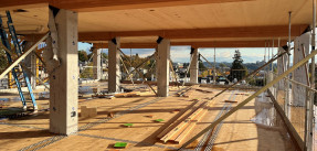 Photo of a construction site of a multifamily building using mass timber
