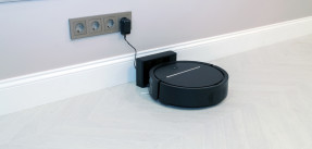 Robotic Vacuum Cleaner Charging Battery Smart Cleaning Technology. Modern smart electronic housekeeping technology