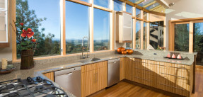 Modern kitchen with large windows and bamboo cabinets