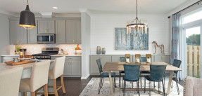 Photo of kitchen and dining room combination, light chairs and modern furniture throughout
