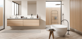 A modern, light bathroom with light colored wood accents and white walls