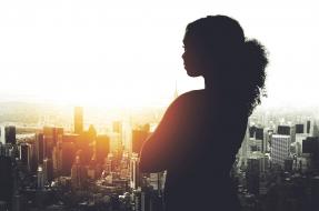 Business woman overlooking cityscape