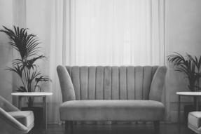 Gray scale image of a couch in a living room