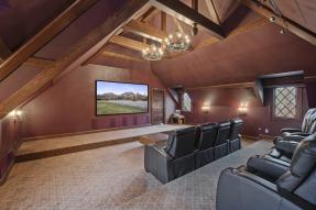 Home theater in luxury house with vaulted ceiling