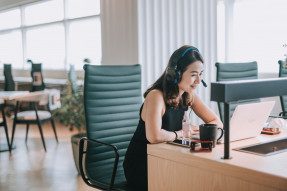 Woman With Headphones on in Office