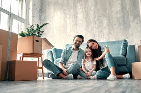 Family in New Home With Boxes