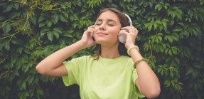 girl with headphones outdoors