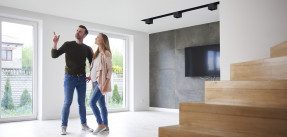 Couple looking around in empty flat