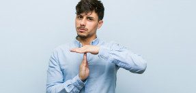 Man showing timeout gesture