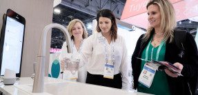 Attendees at the 2020 Consumer Electronics Show test new technology products for the home, such as a smart kitchen sink.