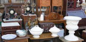Several antique vases, clocks, and pieces of furniture.