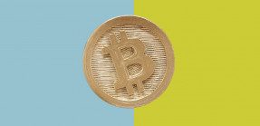 Bitcoin cent piece with colorblock background
