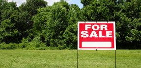 Open property with a For Sale sign