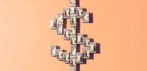 A graphic of the shape of a dollar sign made with folded dollar bills