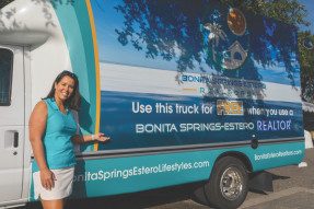 Meighan Harris poses with moving truck