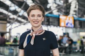 Female flight attendant in an airport
