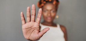 African American woman holding our her hand