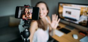 woman using video camera at home