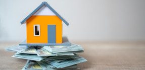 House model on money stack