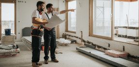 Construction workers in a new house