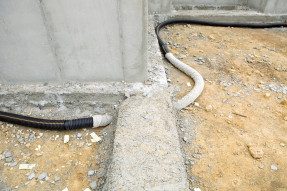 A pipe component of a sub-slab radon mitigation system.