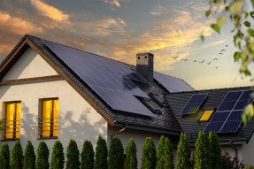 House with roof solar panels at dawn