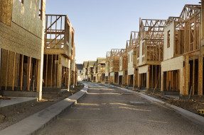 Street view of construction of a housing development