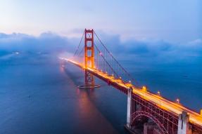 Illuminated Golden Gate Bridge in the mist