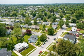Low aerial shot of suburban neighborhood
