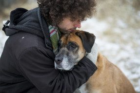 Man hugging a dog