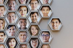 Multi-ethnic headshots in hexagon frames