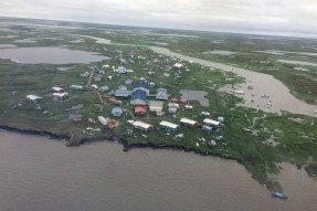 Aerial view of homes and the Newtok School closest to the bank of the Ninglick River in the village of Mertarvik, Alaska.