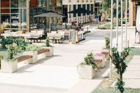 Outdoor plaza with restaurant seating