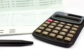 Passbook, pen, and calculator
