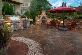 Paver patio with a fire pit, outdoor kitchen 