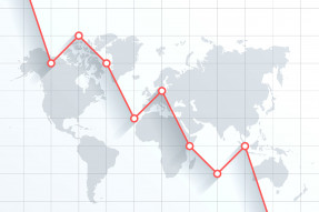 Red line graph superimposed on a gray world map
