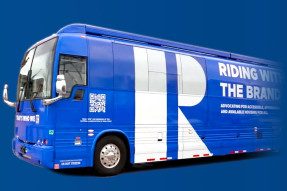 Riding with the Brand bus with REALTOR® blue background