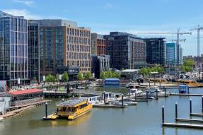View of the DC Wharf showing buildings and a marina on the Anacostia River