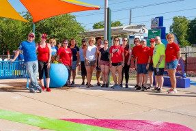 Volunteers pose proudly with their handiwork at the Belleville Transit Center in Belleville, IL.