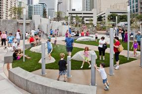 Romare Bearden Park in Charlotte, NC featuring a whimsical splashpad and interactive art forms