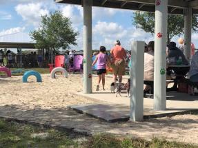 Melbourne, FL dog park - covered area with sand pit, tire toys