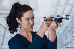 Woman holding a drone