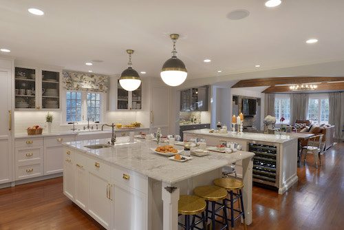 Bright White Kitchen With Two Islands