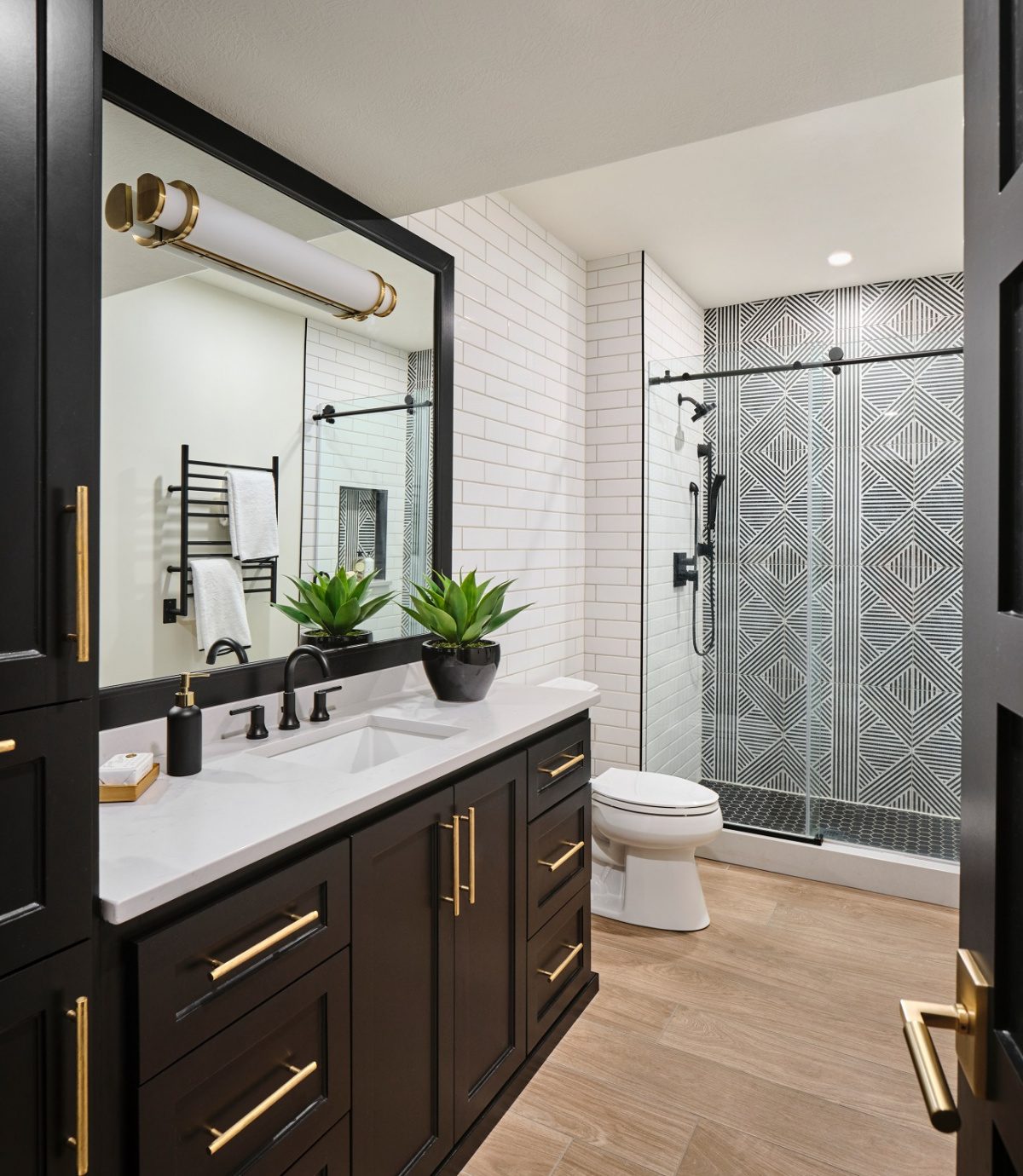 Bathroom with black accents and bold design