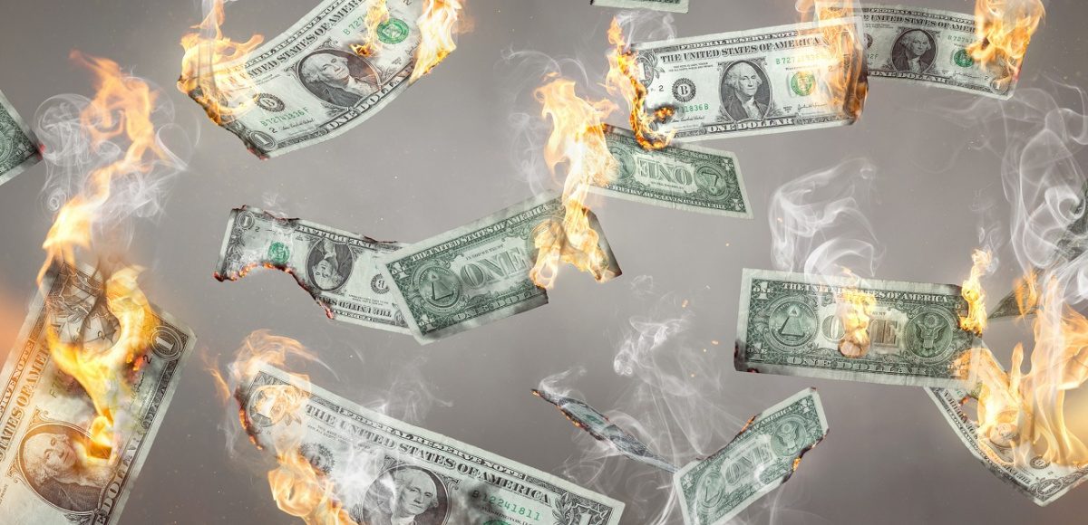 Money on fire falling from the sky