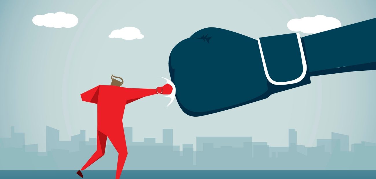 Illustration of a man punching a large boxing glove