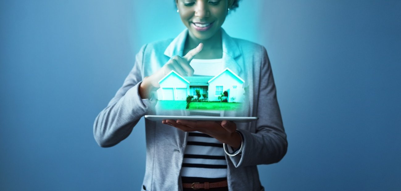 A Woman holding a holographic house in her hands, and smiling